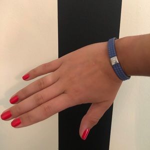 Stretch rubber bracelet with silver charm